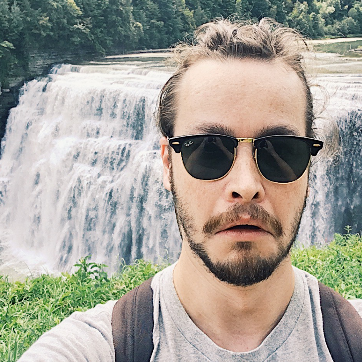 Profile photo of Matthew in front of a waterfall